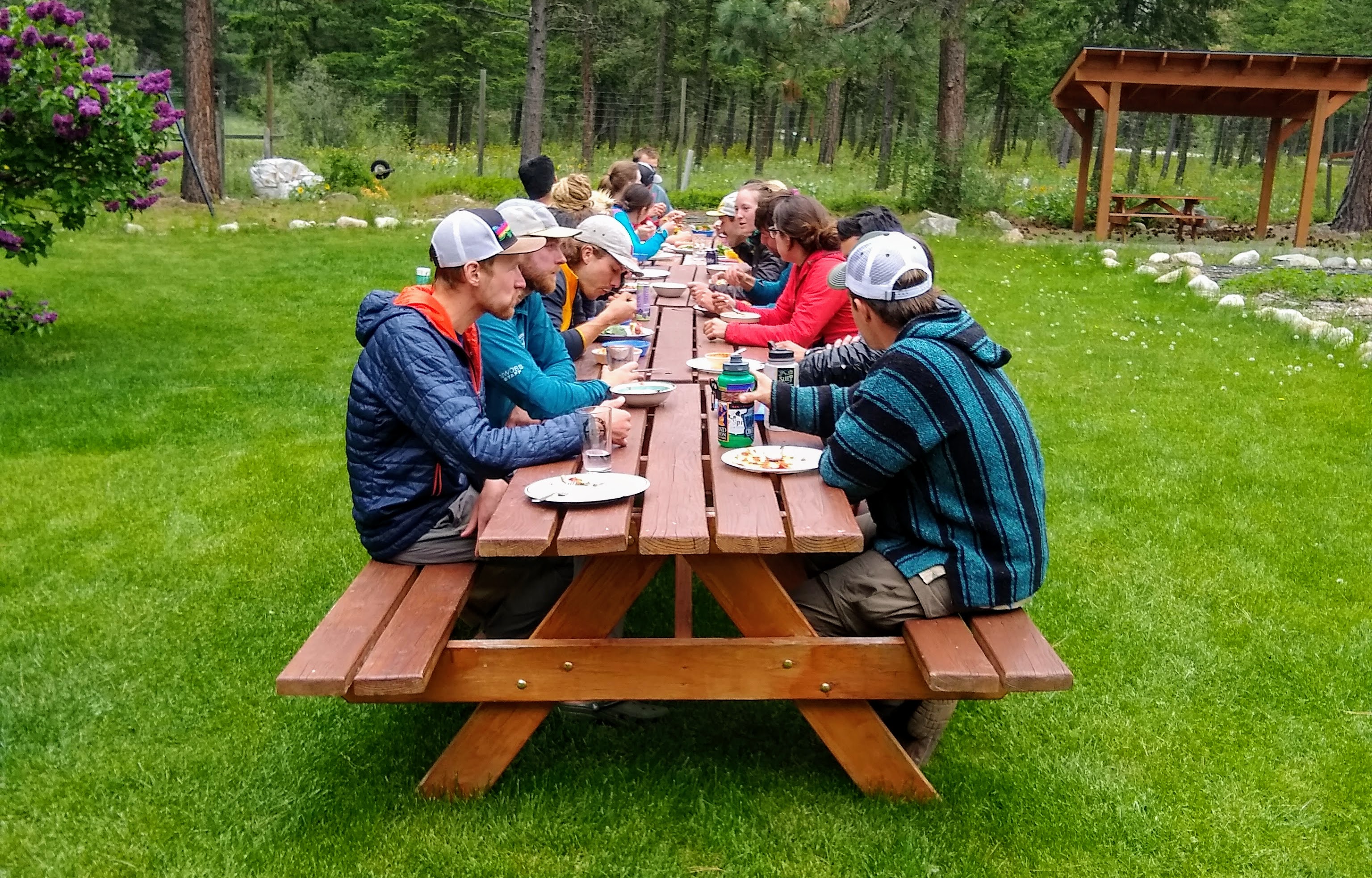 Outward Bound students eating at picnic table